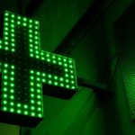 green and white x sign